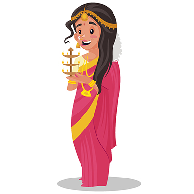 Indian Tamil woman is holding a brass aarti lamp in hands