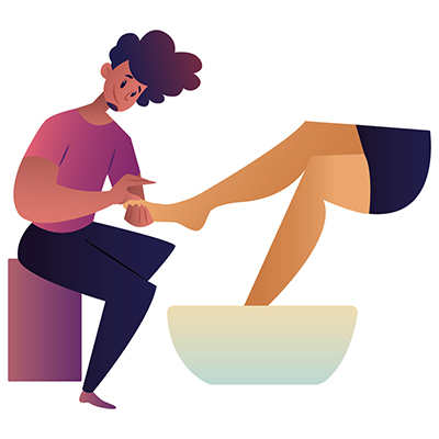 Salon man is doing pedicure of a woman