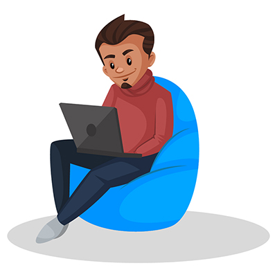 Boy graphic designer is sitting on a bean bag and working on a laptop