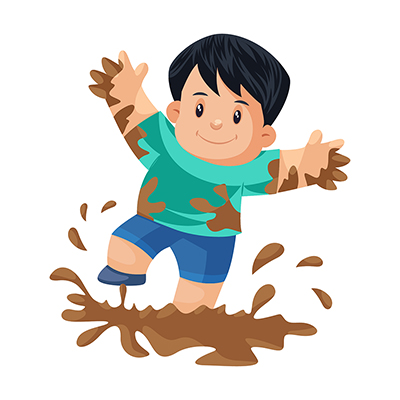 Boy is playing in the mud
