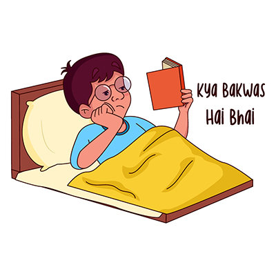 Indian boy is reading book at bedtime