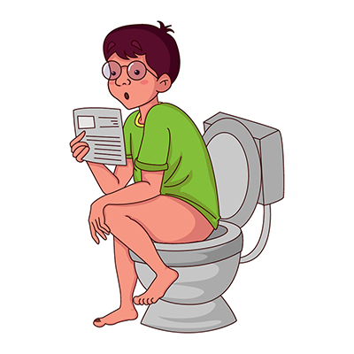 Indian boy reading book in the toilet