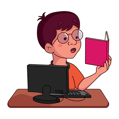 Indian boy reading the book at study table