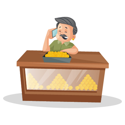 Old Indian male confectioner is talking on phone