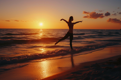 Silhouette picture of girl doing yoga in sunset on beach