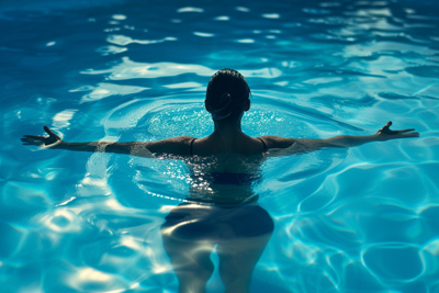 Picture of a woman in pool doing yoga