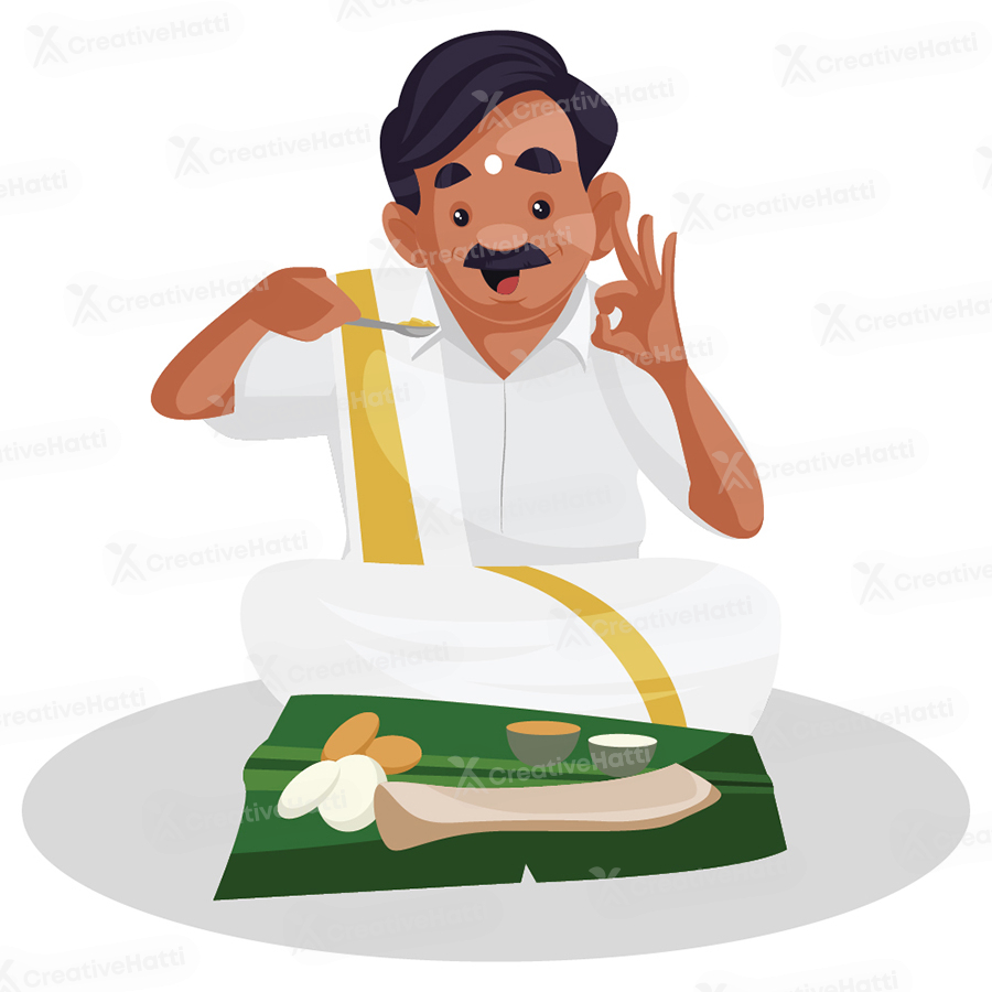 Tamil man is eating food on a banana leaf Tamil man is eating food on a banana leaf